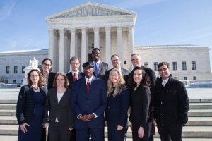 Public Justice Team in front of the Supreme Court