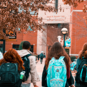 Students with Backpacks heading into a school