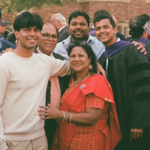 A family smiling at their son's law school graduation.