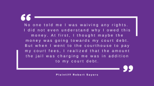 White quotation block with white text on a purple background