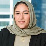 Headshot of a smiling professional woman.